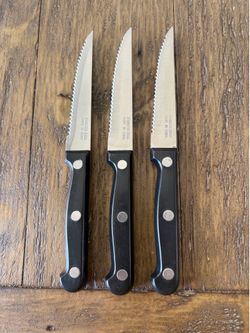 Three serrated stainless steel steak knives.  Unbranded great condition.