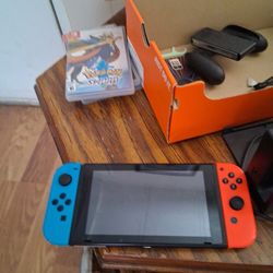 Nintendo Switch, Joy Cons And 3 Games.