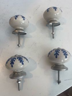Four beautiful classic ceramic knobs.
