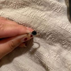 Dark blue ring with diamond accents