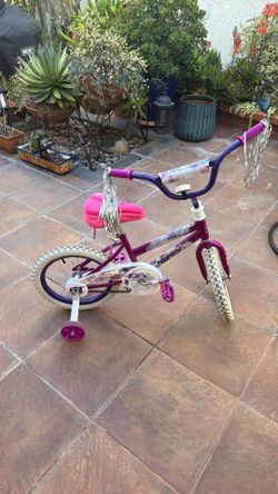 In Great condition- Huffy Kids' Bike - 16" Wheels - Training Wheels - Purple