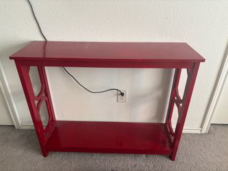Small red entryway/console/tv table