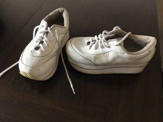 Pair of white vans low-top sneakers