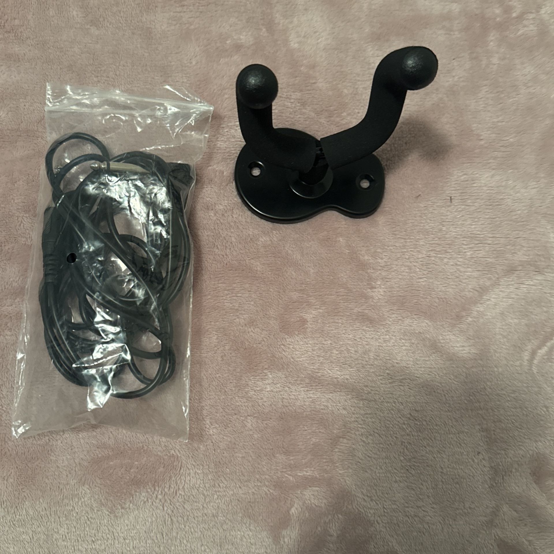 Guitar input and guitar hanger