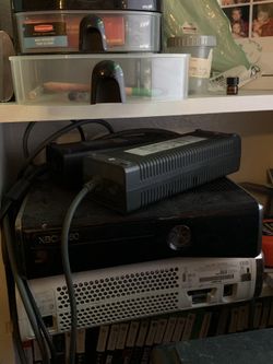 Xbox 360 slim, with games