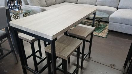 Grey table with 4 stools