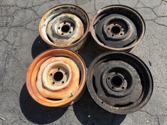 Four 15x5.5 inch Original Mopar Stock Steel Wheels 5x4.5 inch-