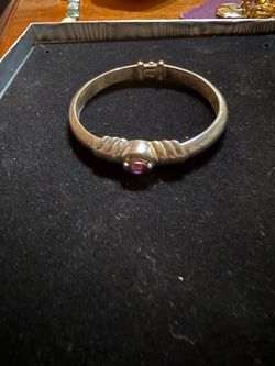 Sterling silver bangle bracelet with amethyst at center
