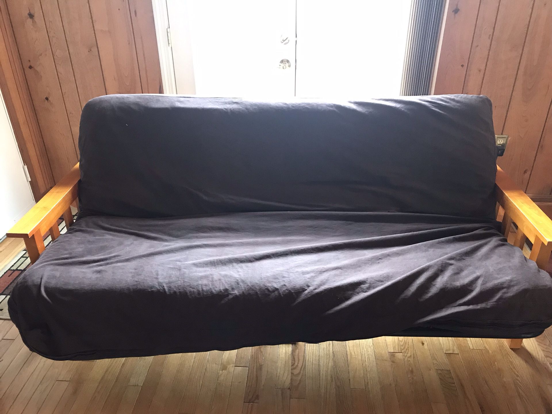 Futon with queen size mattress and cover.