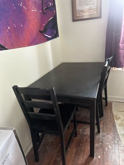 Black Ikea table and 4 chairs