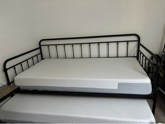 trundle bed, rode iron look, new condition.