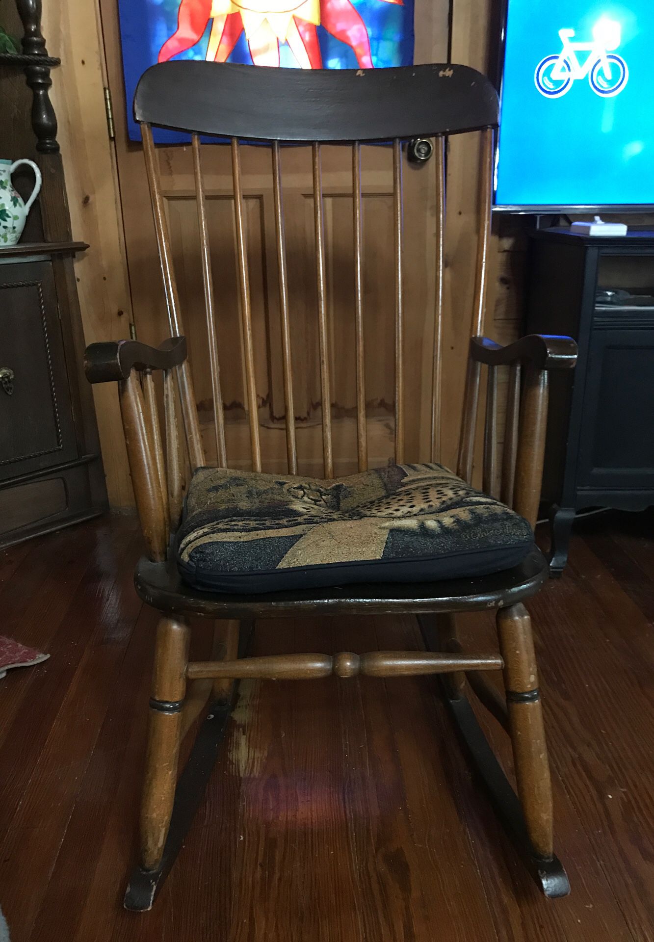 Wooden rocking chair with cushion. Must pick up. $40