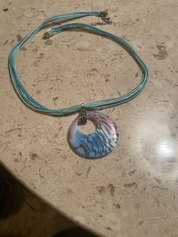 Blue Pendant On A Blue Cord