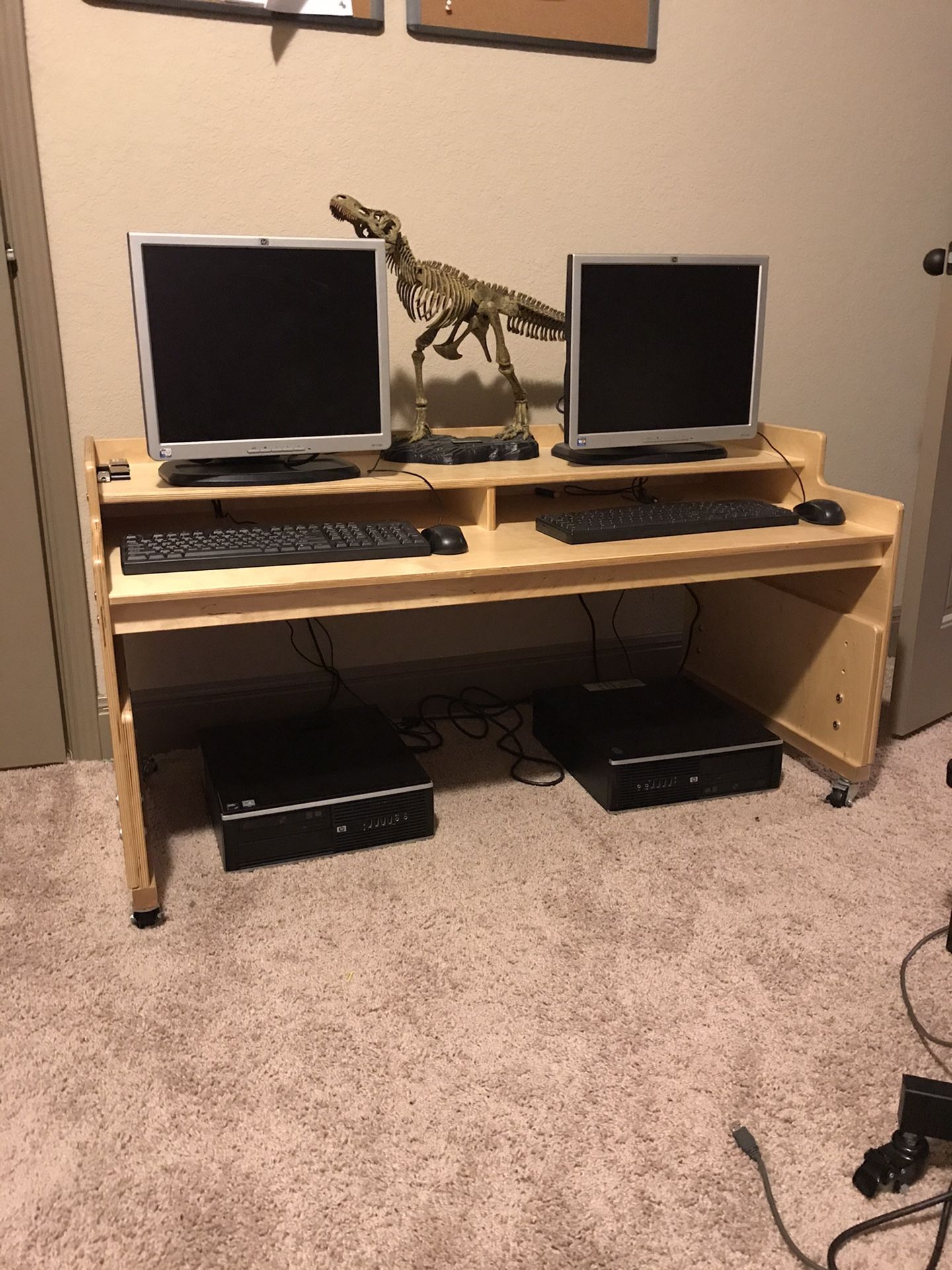 Two HP computers with flat screen monitors