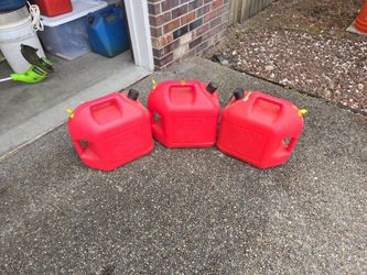 Three 5 gallon gas cans