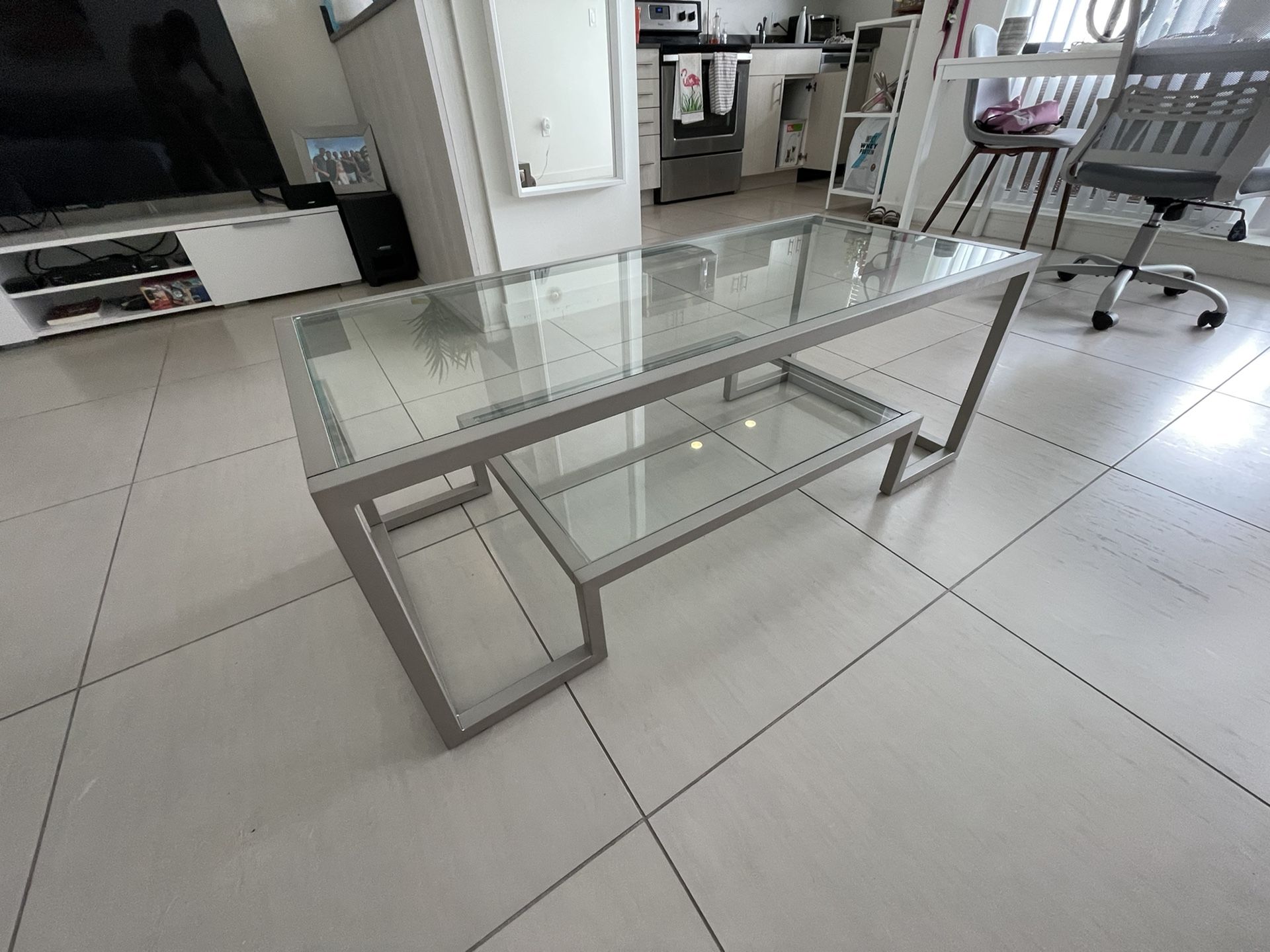 Metal And Glass Silver Coffee Table With 2 Shelves In Geometric Shape