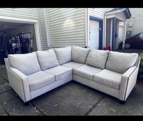 Sectional , tan colored .