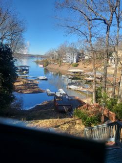 4 bdrm, 3 bath , 3 living rooms on lake with dock and beach. Full main channel views in all 3 living roons and one of the master bedrooms