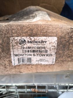 Box of assorted outboard motor and boat parts