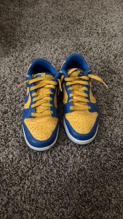 Nike Dunk Low "UCLA" sneakers in Blue Jay and University Gold.
