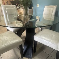 Beautiful Glass Table With Four White Leather Chairs
