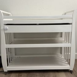 Baby white wood changing table with wheels and storage