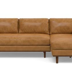 Brown leather L shaped couch set.