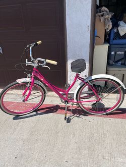 pink and white Schwinn Lulu 26" women's cruiser bike