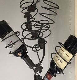 Hanging wrought iron wine rack with grapes, holds 5 bottles