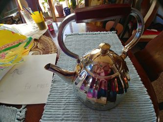 Beautiful shiny stainless steel tea pot kettle