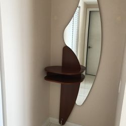 New   Luxury Italian entrance console table with mirror. Mirror has a custom shape. Solid wood table color: Brown Cherry. H80”X W26”. Made In Italy .