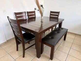 Starting at $53 for a 6-piece rectangular dining table set in cappuccino. Inquire for pricing.