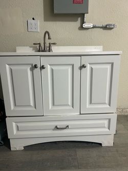 White Bathroom Vanity with Sink and Faucet