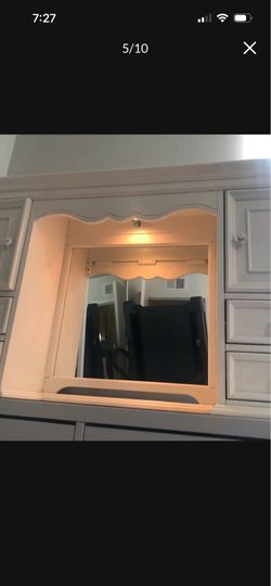 Vanity with lighted mirror