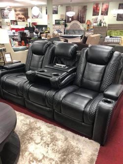 Power reclining sofa with adjustable headrest and LED