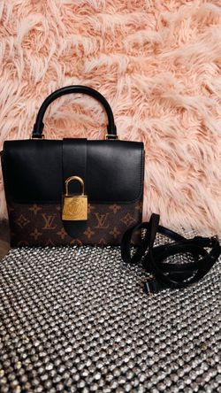 Women’s brown and black purse