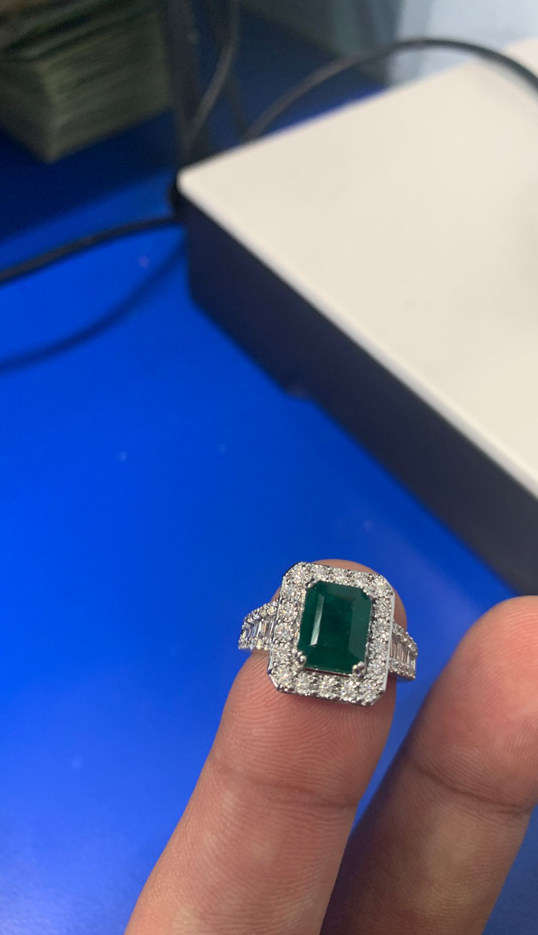 Large center Emerald with diamond baguettes