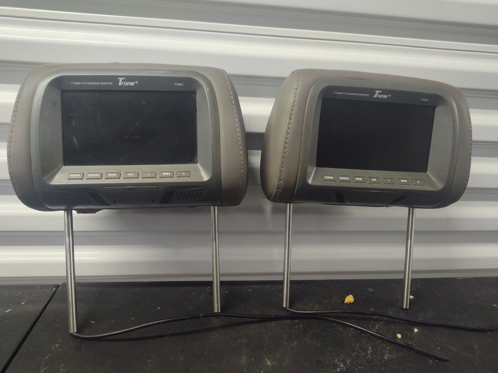 The image shows a pair of Tview T91PL-GR 9” Headrest Monitors
The image shows a pair of Tview T91PL-GR 9” Headrest Monitors, specifically in the grey