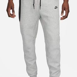 Brand New Grey Nike Tech Joggers (size Medium)