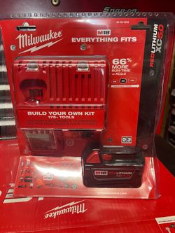 MILWAUKEE M18  CHARGER AND BATTERY 5.0   (( read  below ))