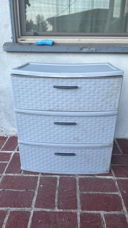 Three drawer wide grey plastic dresser
