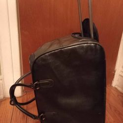 HandBag That Turns Into  a CarryOn with Wheels & Handle.