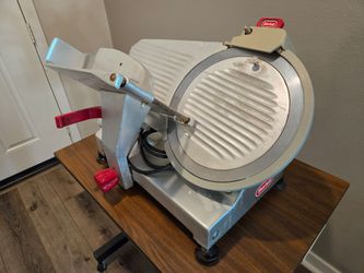 Berkel commercial gravity-feed electric meat slicer