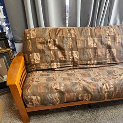 Futon Sofa/Futon Bed/Hardly Used/Non smoking/No pets/in Spare Room/Wood/Side pockets/Ample resting area/Great condition