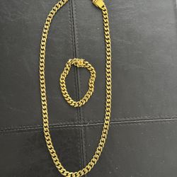 chain and bracelet. Long 30” . Stanley steel. Used in good condition 
