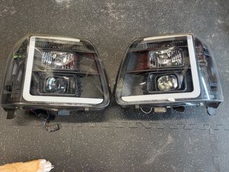 2011 GMC Yukon headlight housing. Used.
