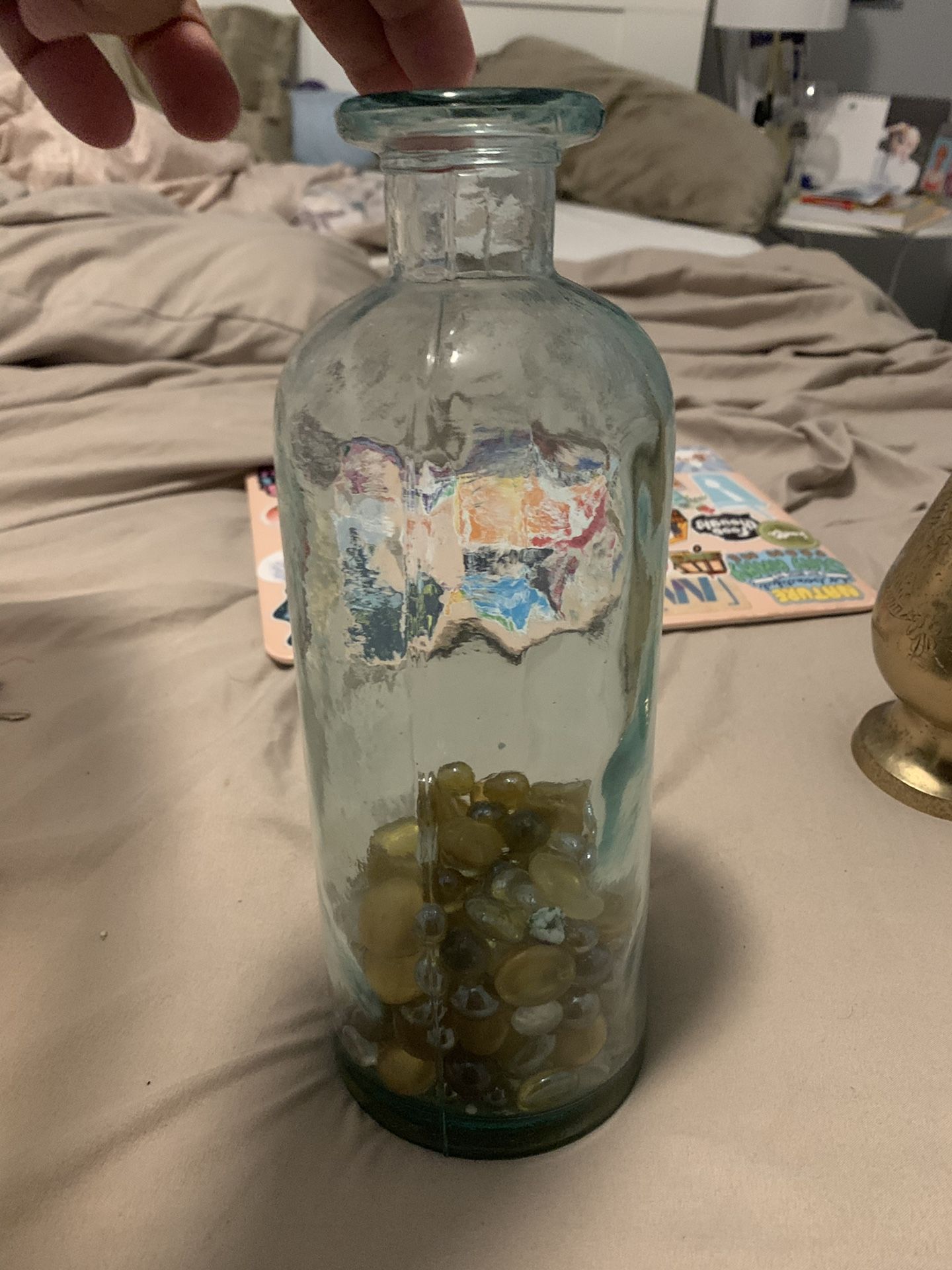 Selling glass vase with pebbles $10 obo