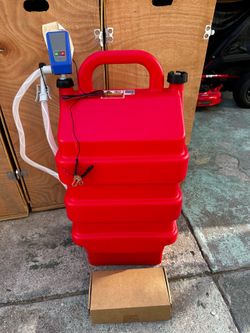 Red portable fuel transfer tank has 16 gallon capacity. It is suitable for gasoline and diesel. Tank includes electric pump with ON/OFF switch and dig