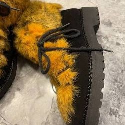 Size 8. Brand new, yellow fur trim leather boots.