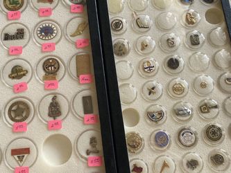 Two display cases of various pins All Kinds Take All cases included
